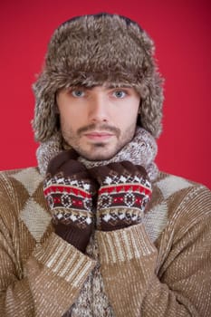 man in fur hat and sweater