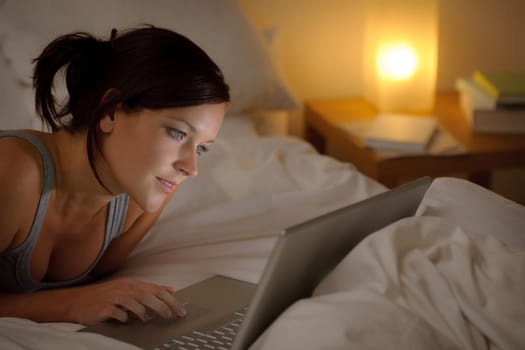Bedroom evening - woman with laptop
