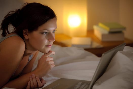 Bedroom evening - woman with laptop