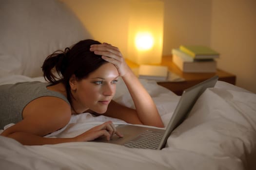 Bedroom evening - woman with laptop