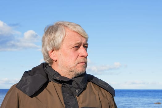 Portrait of mature concerned man with gr
