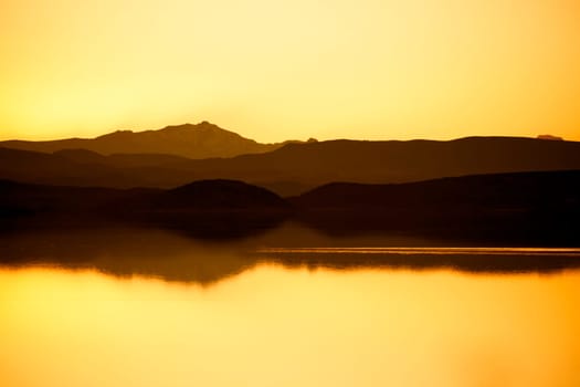 Lake with mountains after sunset
