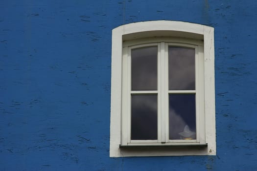 Window in blue wall