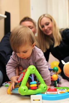Young family at home with toddler