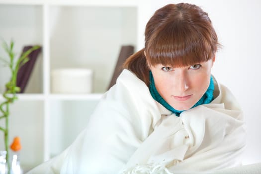 woman resting on sofa