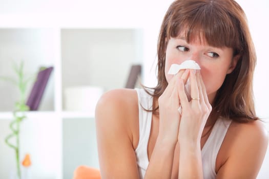 woman sneezing