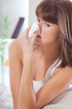 sick woman sniffles
