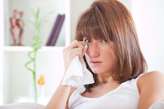 crying woman in bed