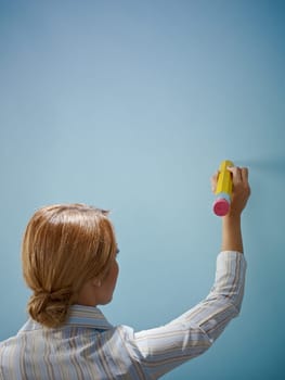 businesswoman writing with big pencil