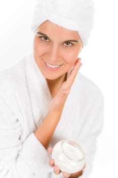 Teenager skin care - woman apply moisturizer