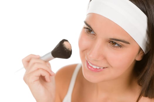Skin care - young woman apply powder