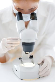 Microscope laboratory - woman medical research