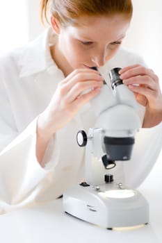 Microscope laboratory - woman medical research