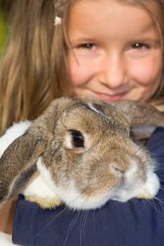 five-year-old girl holding a rabbit (mr)