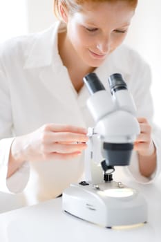 Microscope laboratory - woman medical research