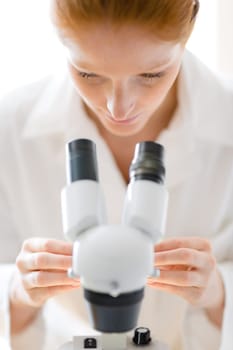Microscope laboratory - woman medical research