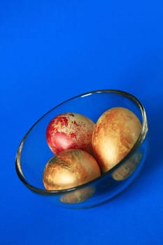 three yellow easter eggs