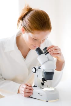 Microscope laboratory - woman medical research