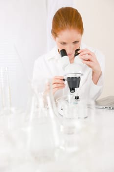 Microscope laboratory - woman medical research