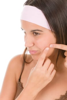 Teenager problem skin care - squeeze pimple
