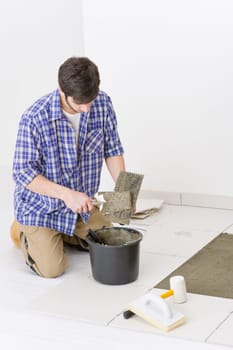 Home improvement - handyman laying tile