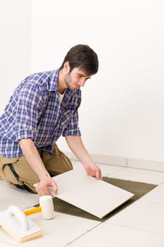 Home improvement - handyman laying tile
