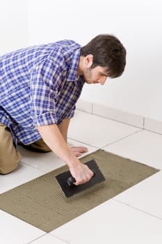 Home improvement - handyman laying tile