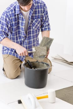 Home improvement - handyman laying tile
