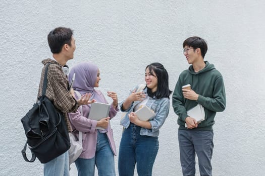 Outdoor of smiling university young group students college man and women students college smiling stand holding books and laptop computers on campus, Education concept, Back to college concept.