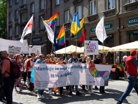 TALLINN, ESTONIA - JUNE, 10, 2023: gay pride parade of freedom and diversity, happy participants walking. Baltic Pride is an annual LGBT festival