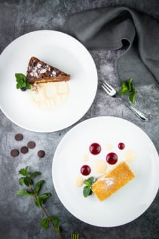 white sponge cake with drops of syrup, mint and wild berries