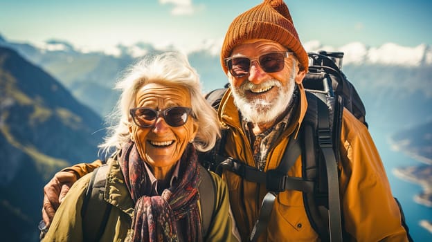 Portrait of a happy retired couple traveling in the mountains in autumn. High quality photo