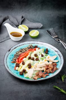 appetizer of meat, quail eggs, bell pepper, croutons, lettuce and sauce