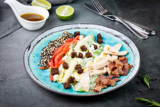 appetizer of meat, quail eggs, bell pepper, croutons, lettuce and sauce