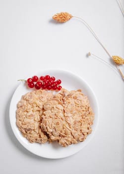 whole grain cookies with a sprig of red currants