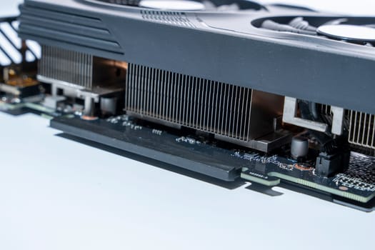 a modern powerful gaming graphics card for a computer with three fans. the concept of PC hardware. Gaming video card