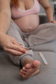 Pregnant woman trying to get herself a pedicure