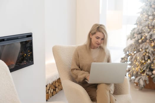 Portrait of attractive cheerful girl watching video resting at christmas.