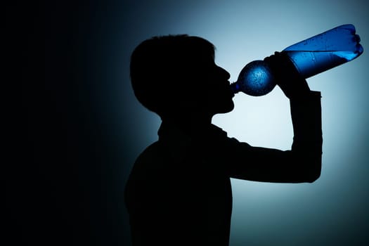 businesswoman drinking water in office