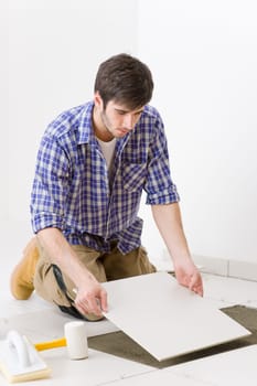 Home improvement - handyman laying tile