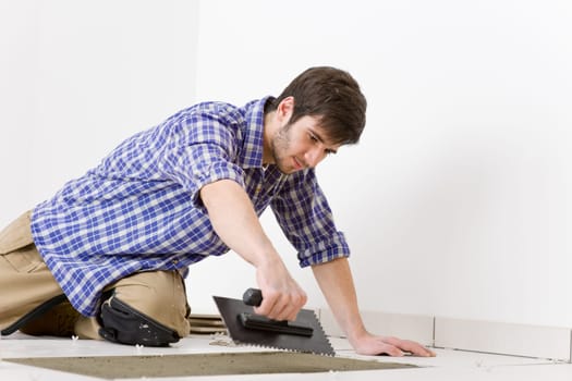 Home improvement - handyman laying tile