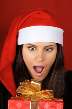Santa Claus girl with Christmas present