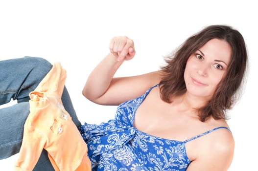 Portrait of pretty pregnant woman baby clothes