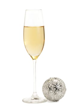Sparkling wine with metal Christmas tree ball