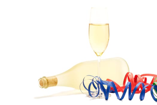 Sparkling wine with bottle behind streamers