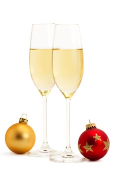 Sparkling wine with two Christmas tree baubles