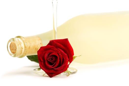 Sparkling wine with red rose and Prosecco bottle