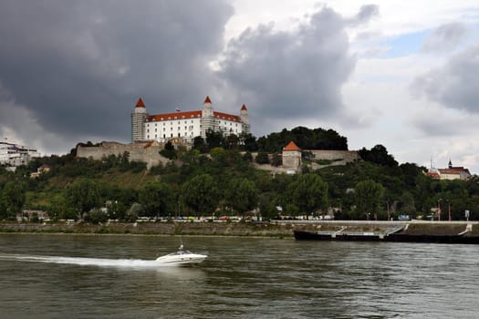 Bratislava (capital of Slovakia) castle with river Dunaj and motorboat
