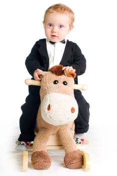 Chic child on rocking horse