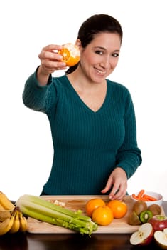 Woman presenting peeled ornage fruit